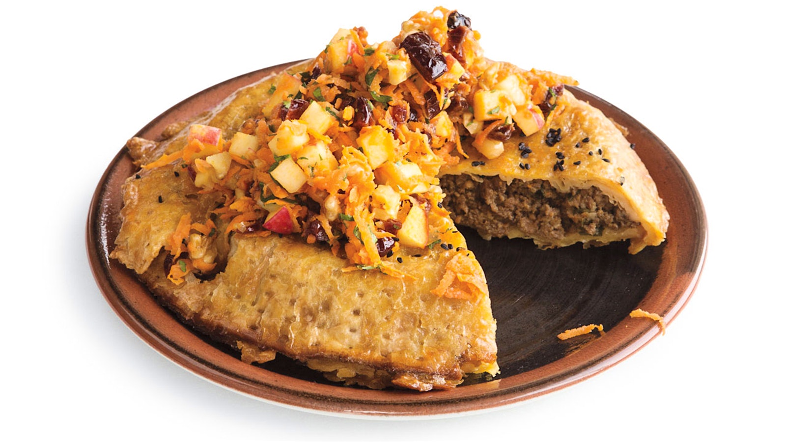 A savory ground beef mina topped with charoset